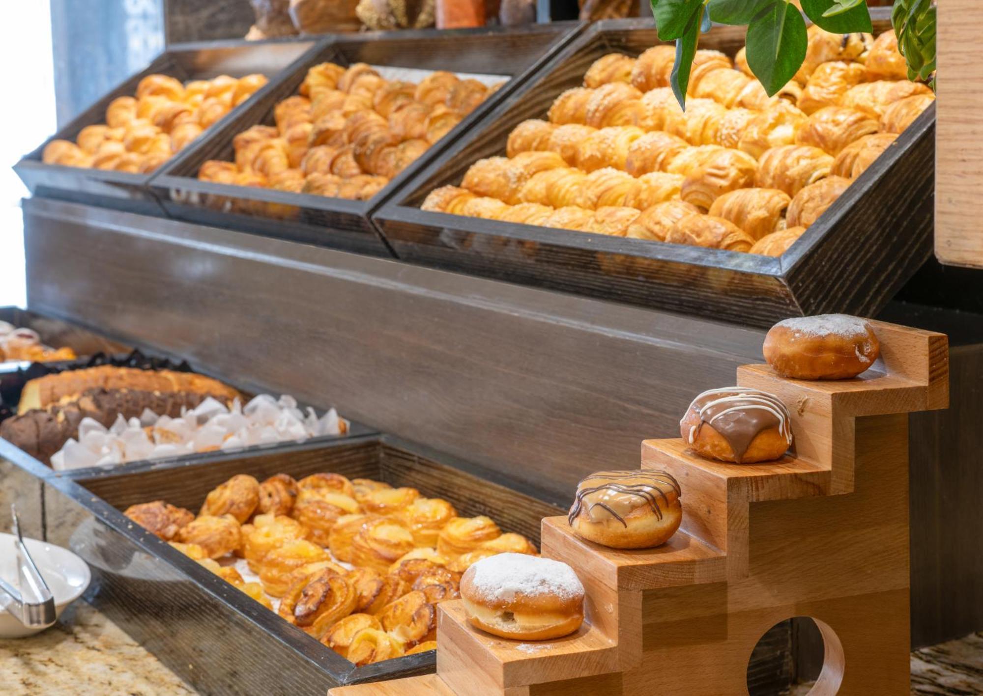 Triumph Luxury Hotel Каир Экстерьер фото Croissants and other pastries at a buffet